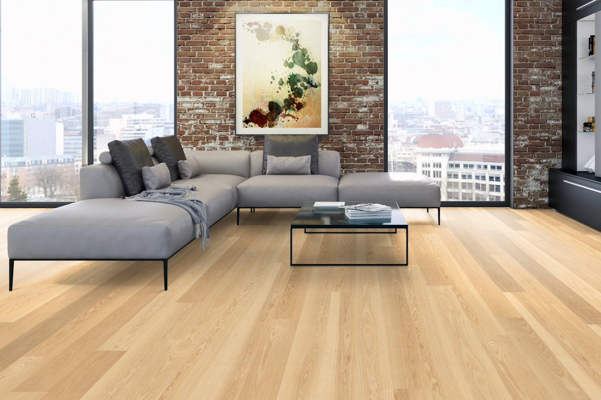 Wideplank Ash Natur Natura Modern loft with natural ash hardwood floors next to a brick wall and gray interior