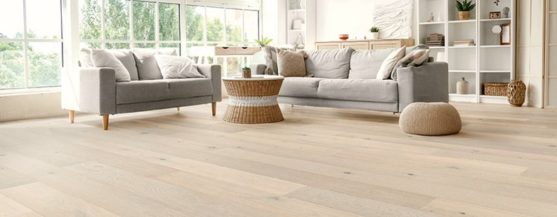 Bright living room in Scandinavian style, with light parquet flooring