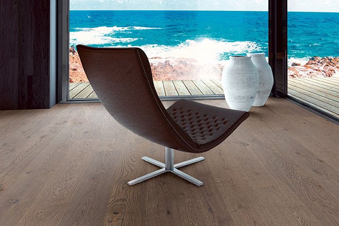 Lounge chair with sea views and dark oak parquet