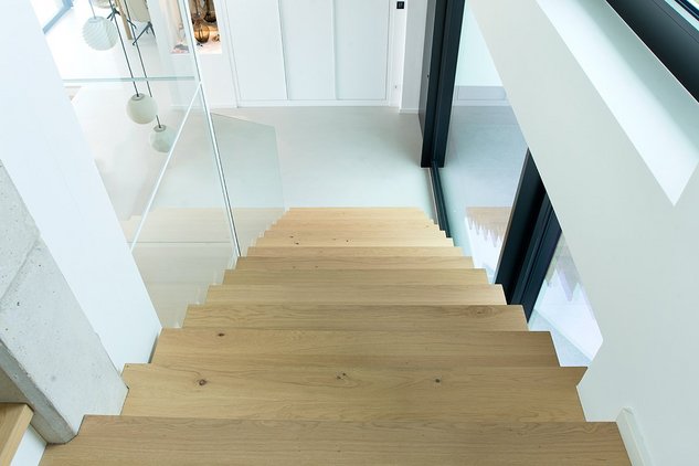 Modern oak steps leading down to the basement