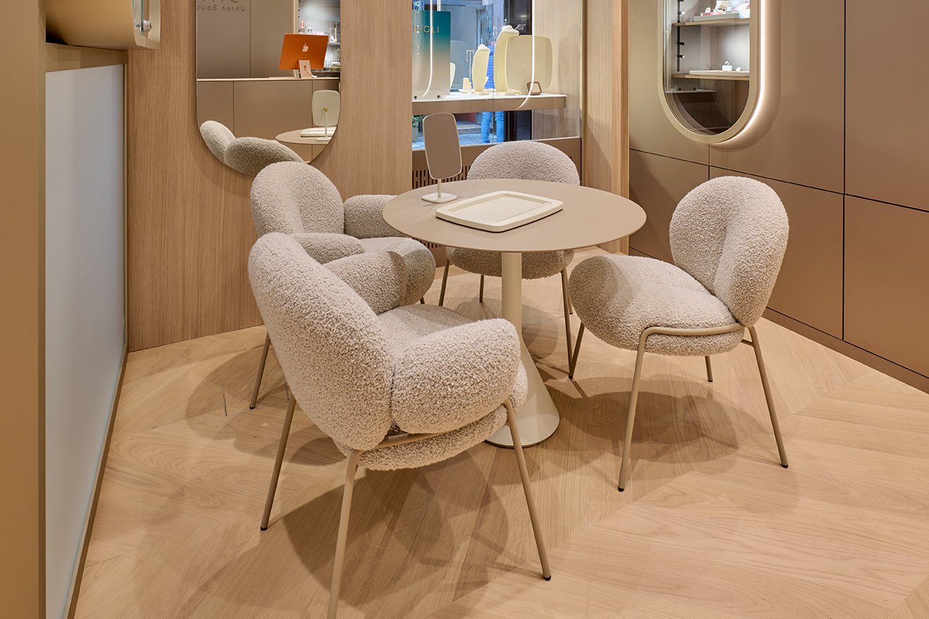 White oiled French herringbone parquet flooring in a store in Salzburg