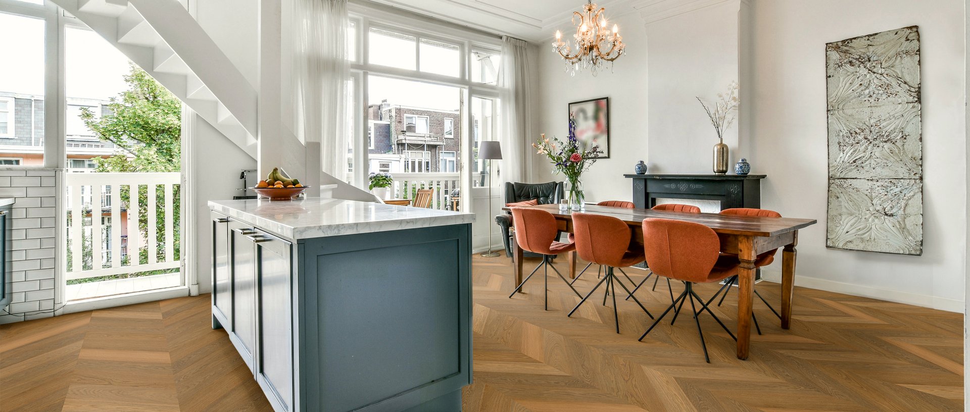Dining room in classic style with warm Chevron parquet flooring 