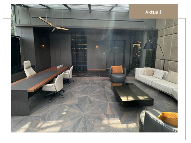 Dark parquet flooring with an elegant design pattern in a modern office